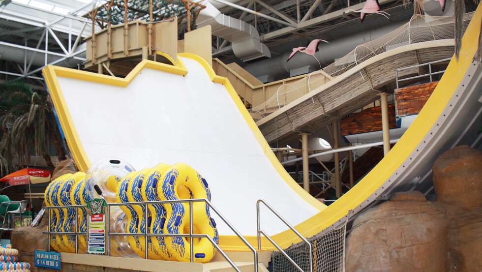 Sandcastle Waterpark Photos yellow slide